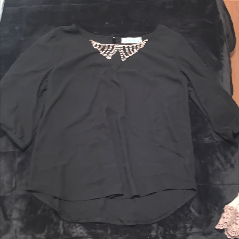 Woman’s black sheer blous